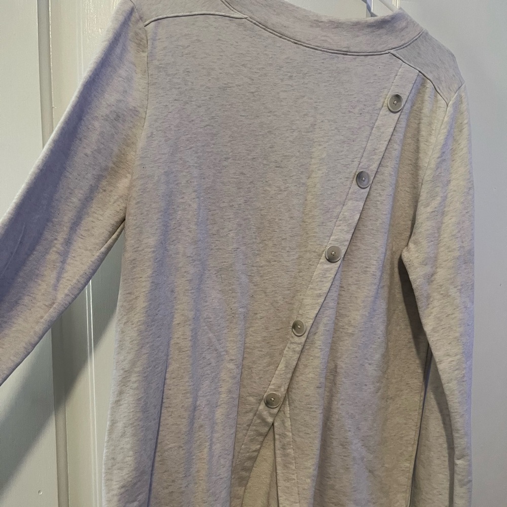 Lift cream sweater. Buttons up back